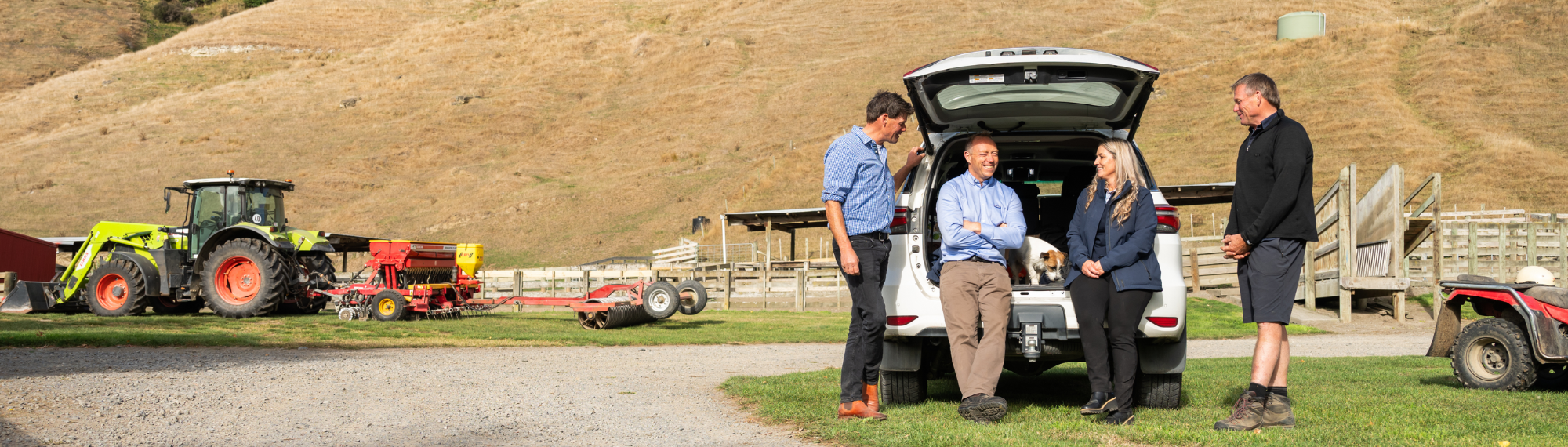 client and staff sitting back of ute